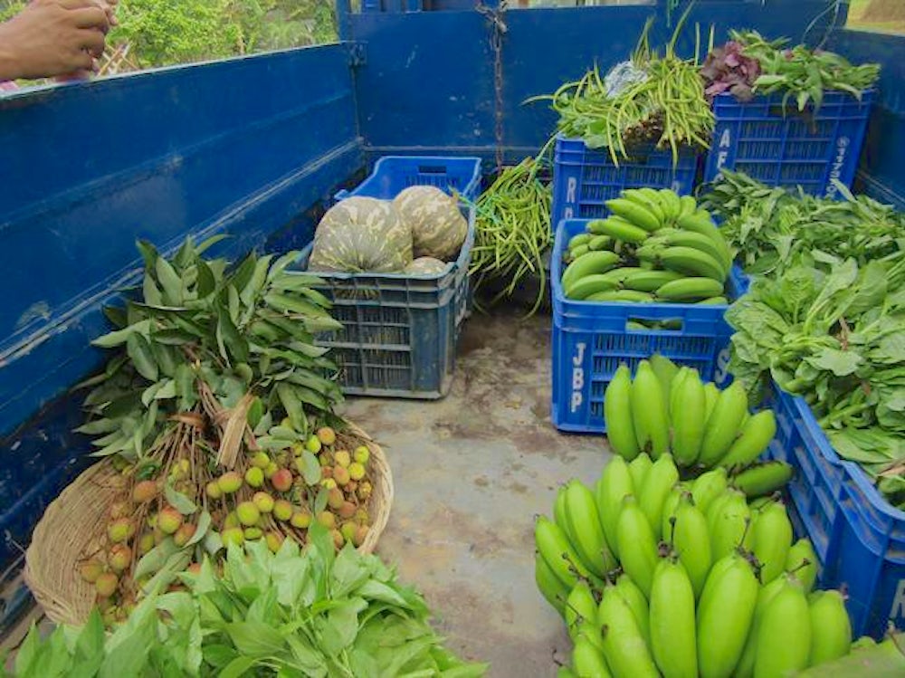 A van full of vegetables to go to a trader that sells produce in Dhakha, Bangladesh.