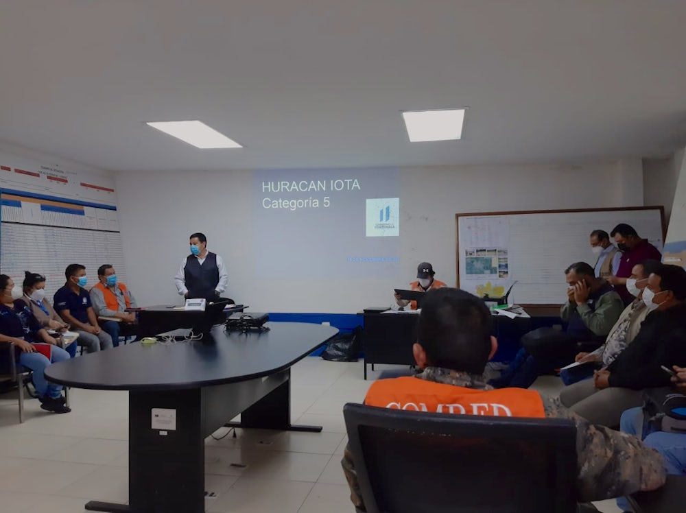 A meeting of COMRED during Hurricane Iota.