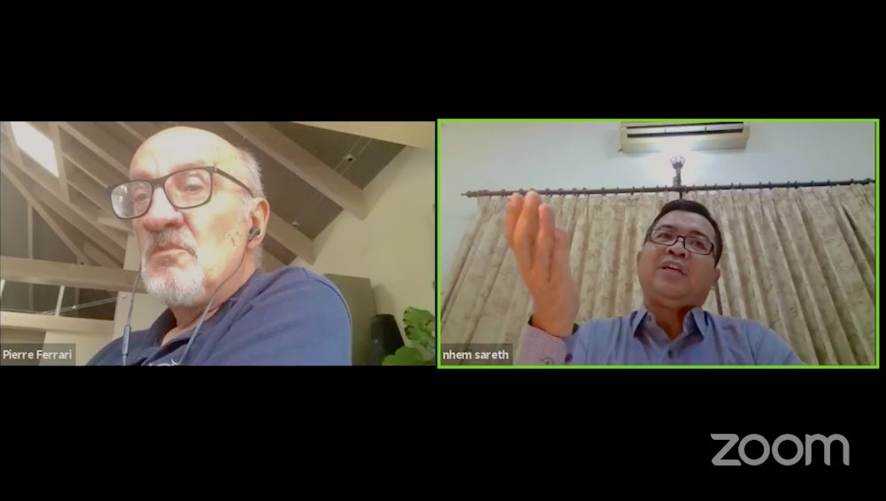 Sareth Nhem, Country Director of Heifer Cambodia, and Pierre Ferarri talk tuk tuks.