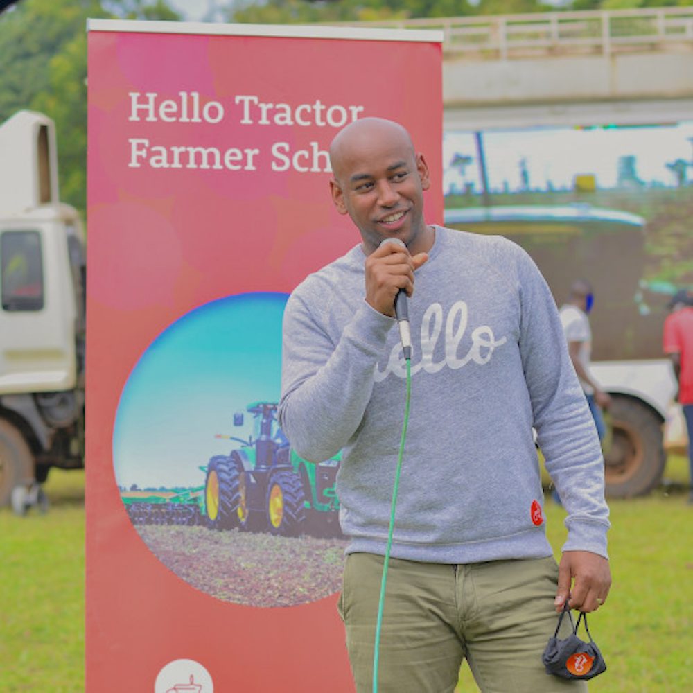 The founder and CEO of Hello Tractor speaks at a microphone.