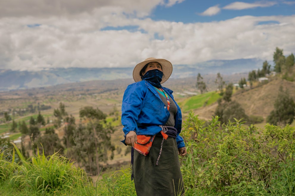 A woman at her farm in Ecuador.