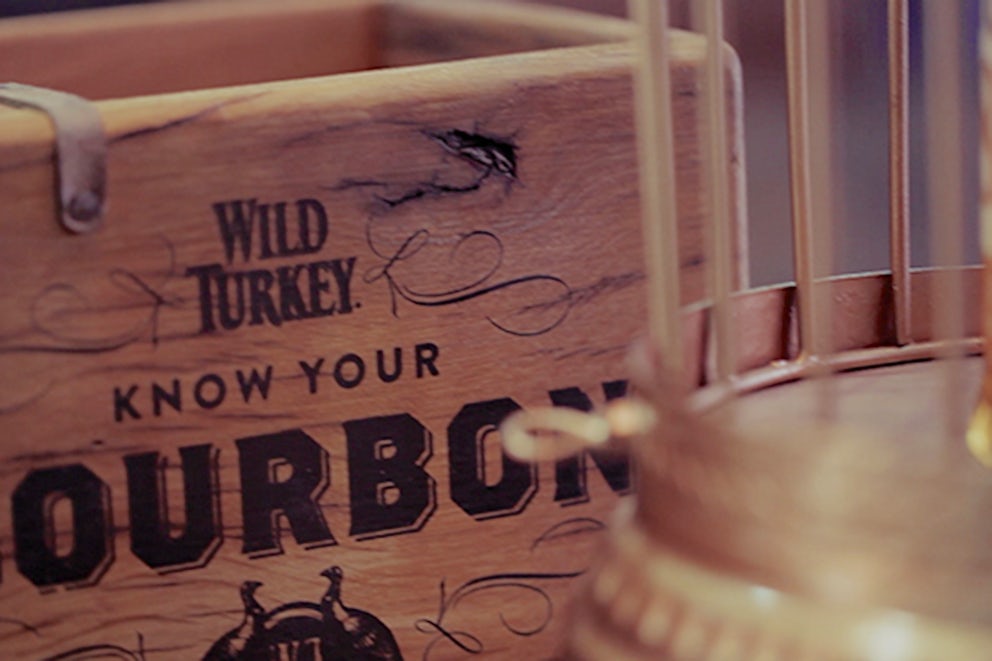 A close up view of a Wild Turkey Bourbon crate with the words