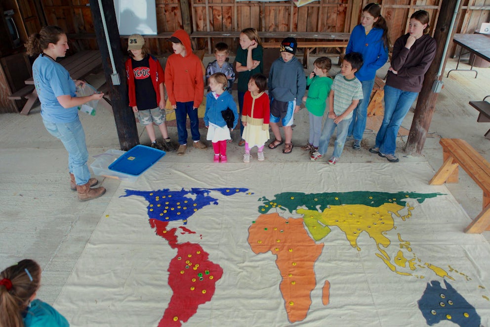 A group of students look impressed as they learn.