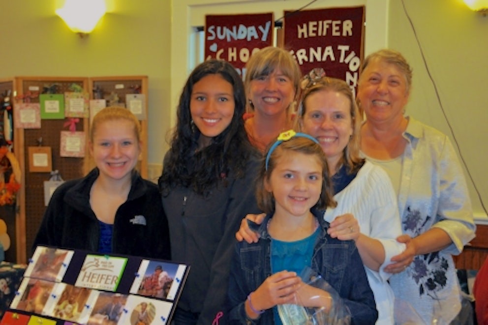 A group of successful fundraisers smiles at the camera.